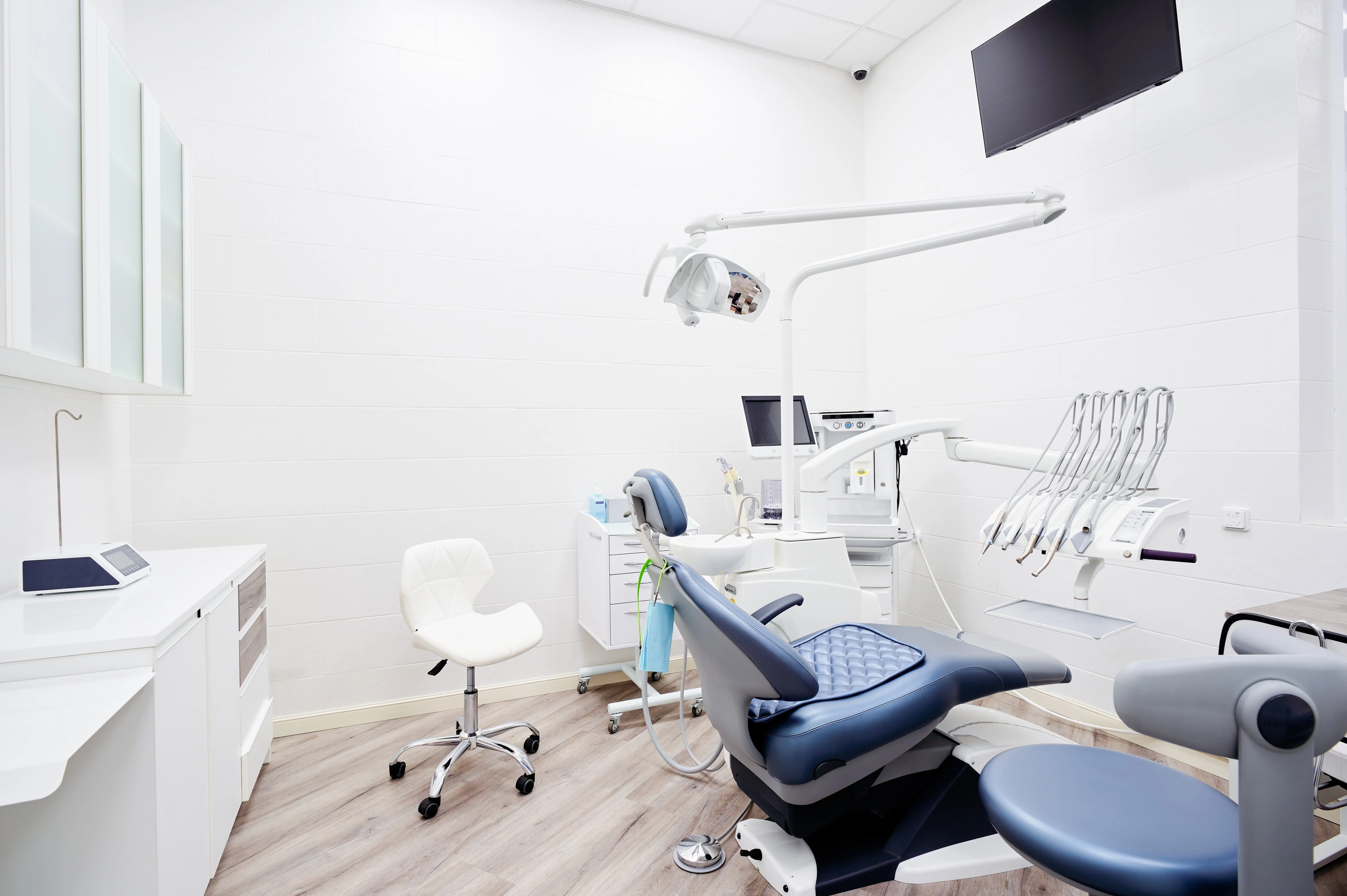 Modern orthodontic treatment room featuring advanced dental equipment, including a patient chair, diagnostic monitors, and a clean, bright environment, emphasizing Ortho:Dana's commitment to cutting-edge orthodontic technology in West Valley City, UT.